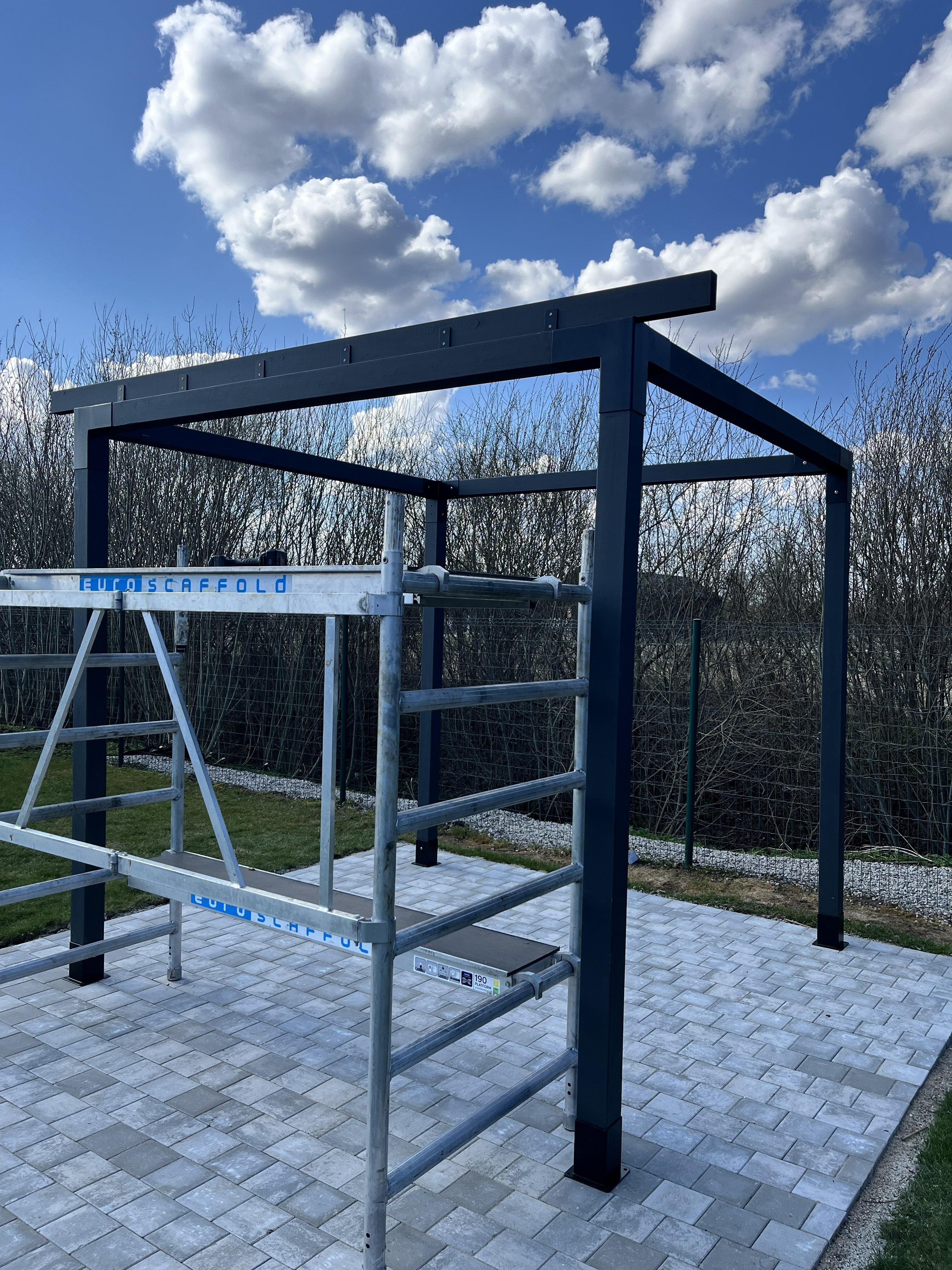 Modular canopy DIY by Terases, 3.5m x 3.5m, featuring sturdy metal frame with beige fabric roof for outdoor shading.