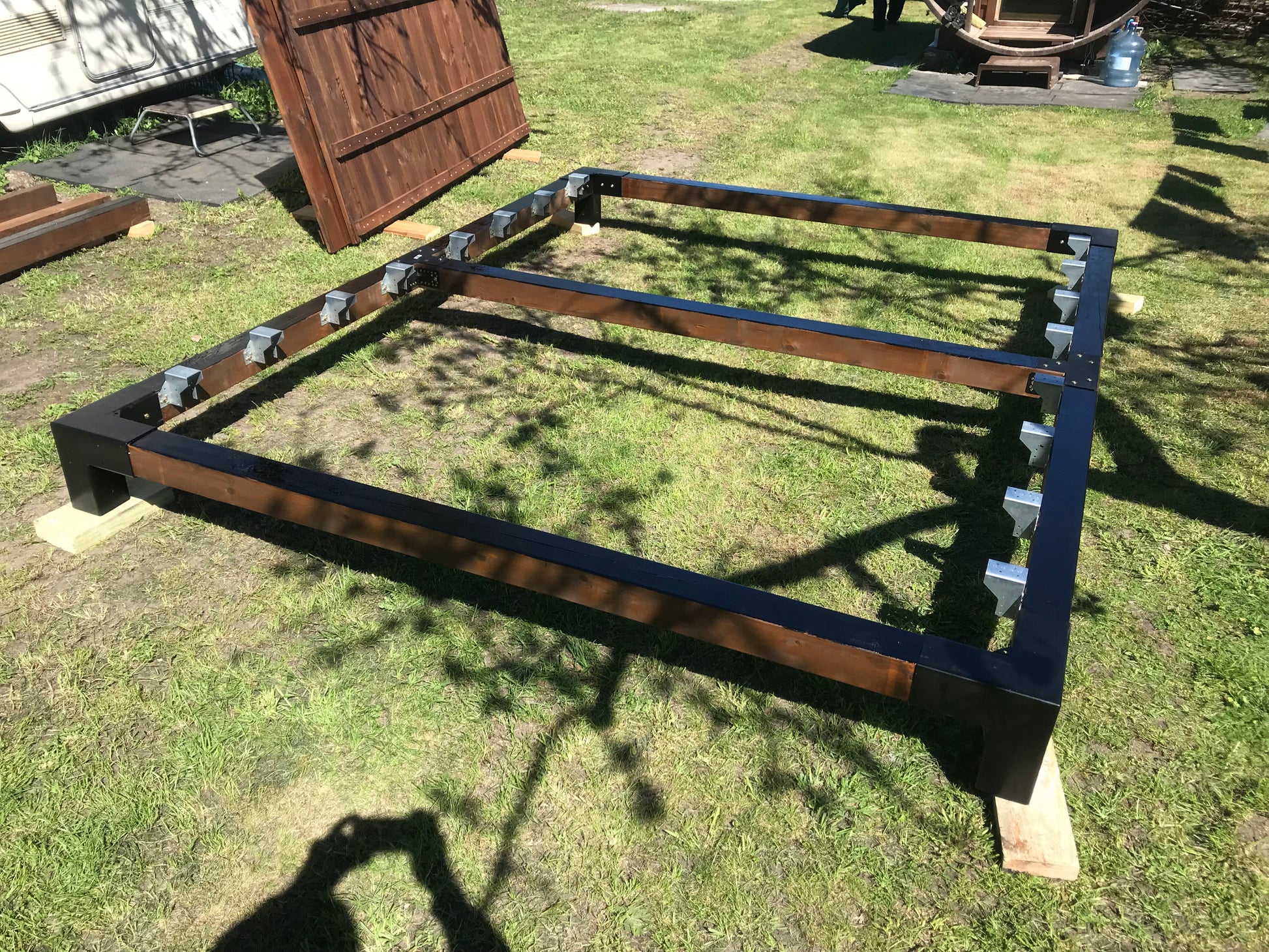 Wooden deck frame on a grassy area