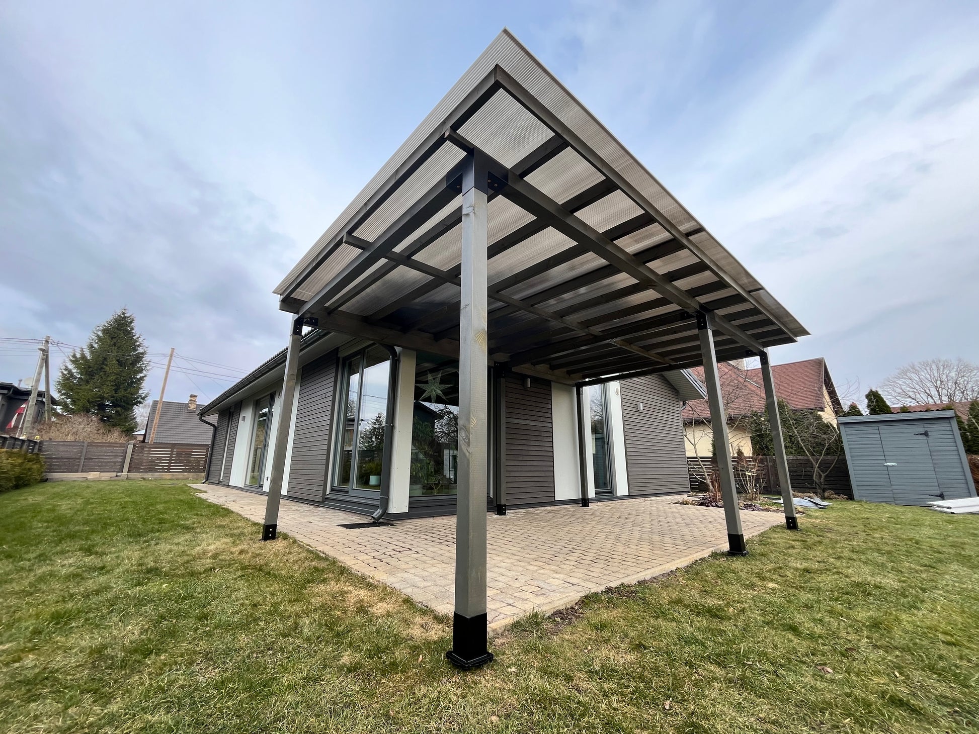 Modern carport with solar panels on a clear day