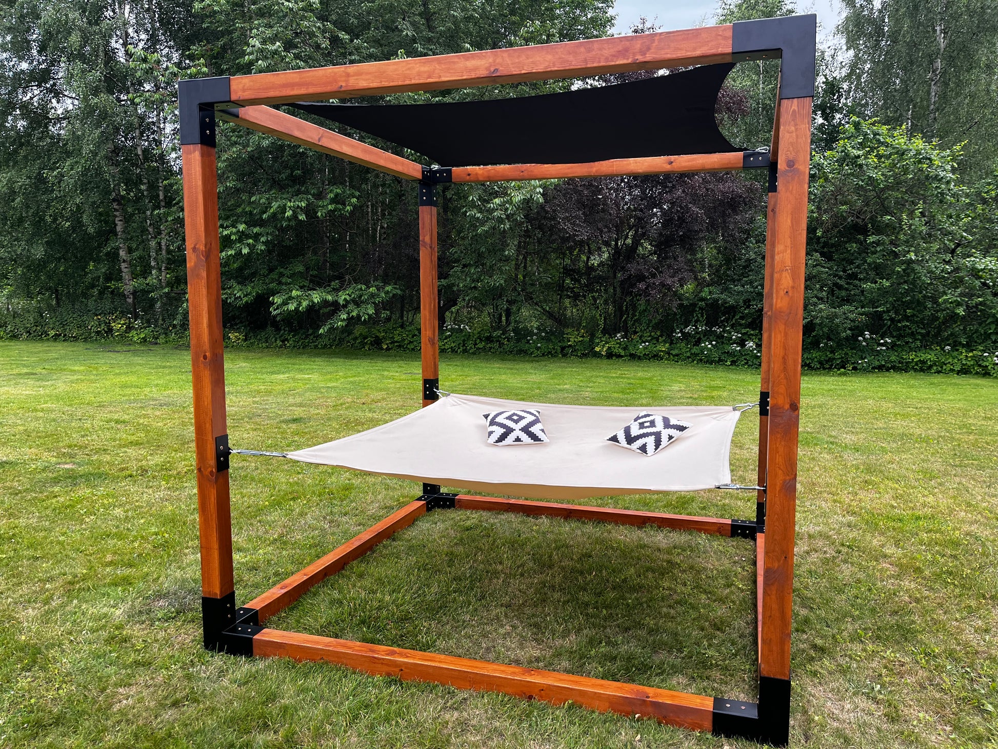 Sunshade for modular relaxation cube with tensioners.