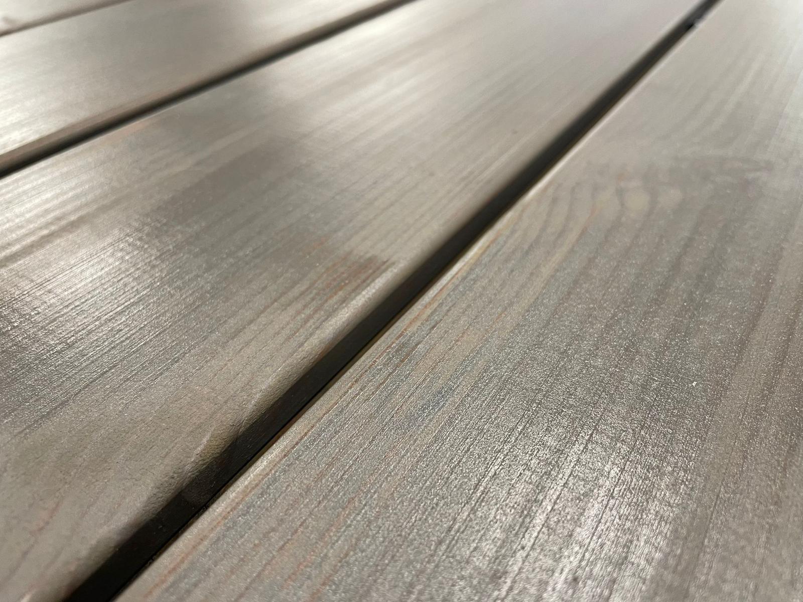 Close-up of wooden planks with a focus on texture and grain.