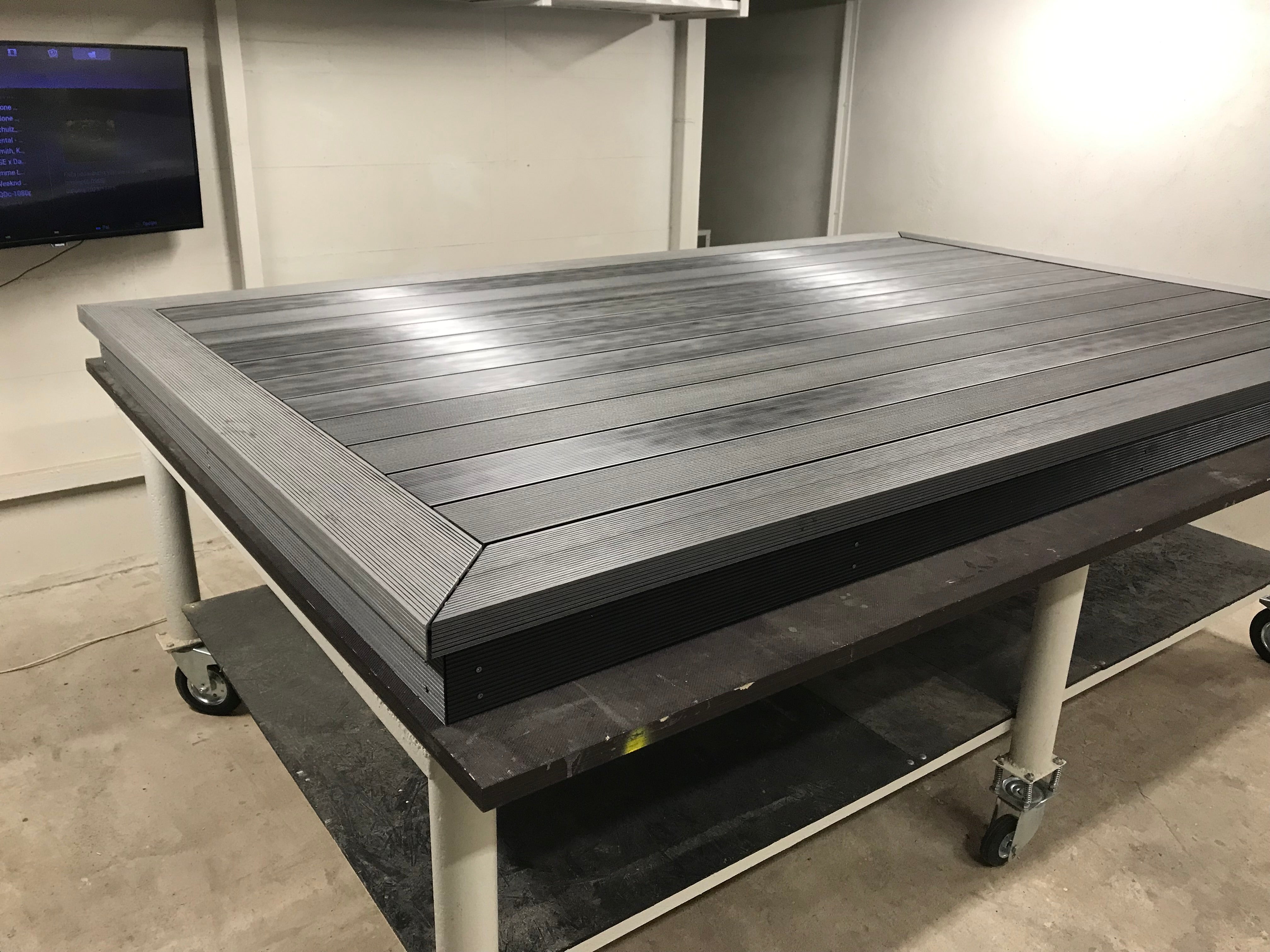 Large gray worktable with wheels in a room setting